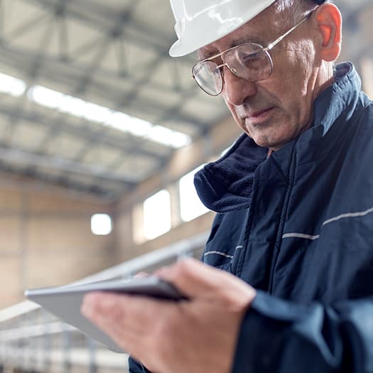 Manufacturing worker using tablet