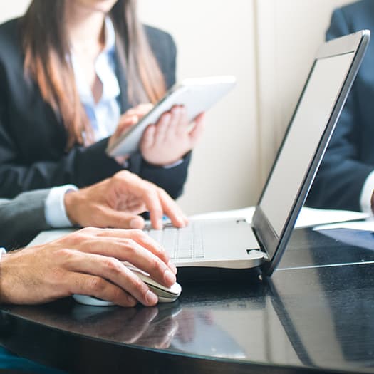 Business meeting on laptop and tablet